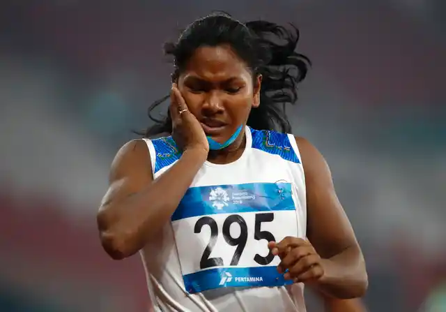 India’s Swapna Barman reacts after her heptathlon 200m during the athletics competition at the 18th Asian Games.