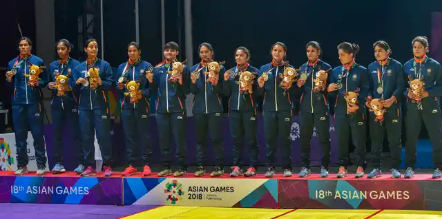 The Indian women’s kabaddi team with their silver medal on the podium at the 2018 Asian Games.
