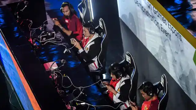 Indonesian team compete in the eSports exhibition (Arena of Valor) at the 18th Asian Games.