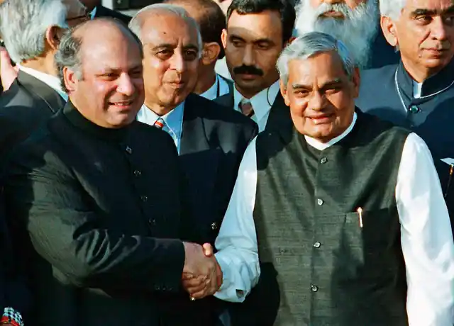 1999 file photo, Pakistani Prime Minister Nawaz Sharif, receives Indian Prime Minister Atal Bihari Vajpayee at the Wagah border near Lahore.