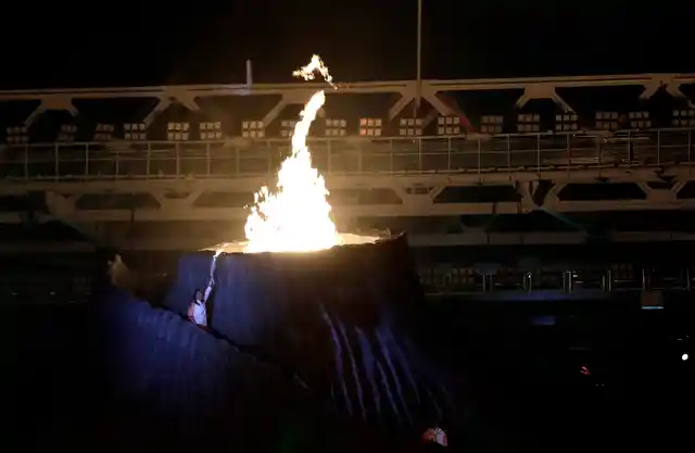 Susi Susanti lights the Asian Games cauldron.