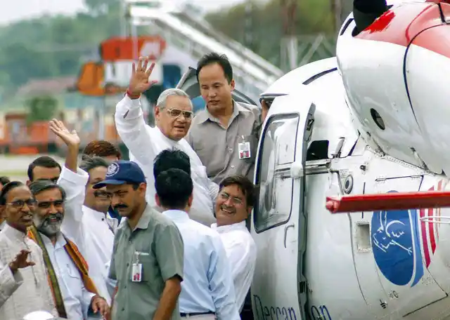 In this 25 July, 2004, file photo former prime minister Atal Bihari Vajpayee leaves for the aeriel survey of flood-hit areas in Patna, Bihar.