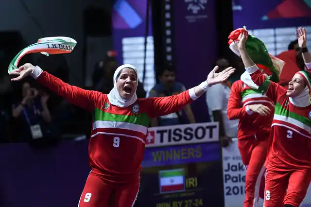 Iran’s team, in red, react after defeating India in the women’s kabaddi gold medal match at the 18th Asian Games in Jakarta, Indonesia.