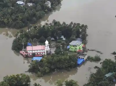 Kerala: An aerial view of the flood-hit areas of Kerala on Aug 18, 2018. Overflowing rivers and a series of landslides have caused the death of 180 people as of Saturday morning, with over three lakh people forced to move to some 2,000 relief camps. The disaster has triggered an unprecedented rescue and relief operation led by the Army, the Air Force and the Navy along with teams of National Disaster Response Force involving about 1,300 personnel and 435 boats. Prime Minister Narendra Modi on Sa