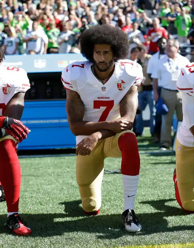 In this Sept. 25, 2016, file photo, San Francisco 49ers’ Colin Kaepernick kneels during the national anthem before an NFL football game against the Seattle Seahawks, in Seattle. 