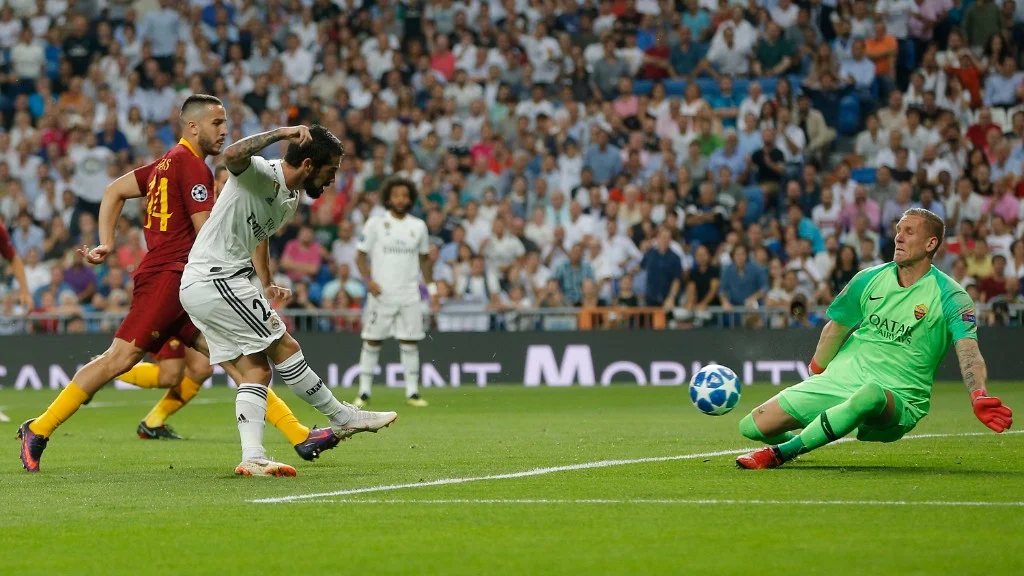 Roma goalkeeper Robin Olsen defends a shot from Realmidfielder Isco during their Champions League match in Madrid on Wednesday.     