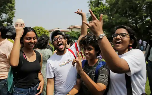 LGBTQ activists celebrate after the country’s top court read down parts of a colonial-era law that made homosexual acts punishable.