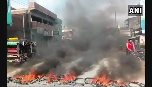 Protesters set fire to tyres in Bihar’s Mokama.
