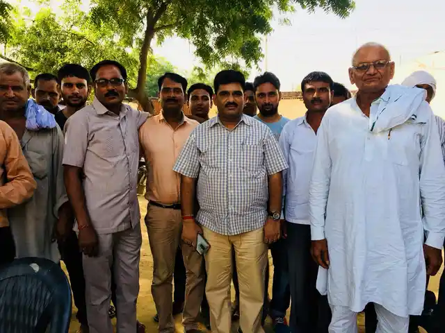 Right in the middle is Abhay Pratap Singh who says those who are agitating are very few and largely, like the farmers around him, people have given consent.