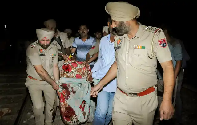 Police carry casualties of the Amritsar train accident, even as rescue operations continue in earnest.
