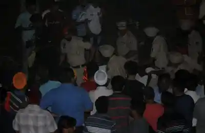 Amritsar: Police at the site where at least 30 people glued to watching a burning Ravan effigy while standing on railway tracks were crushed by a speeding train in Amritsar on Oct 19, 2018. (Photo: IANS)
