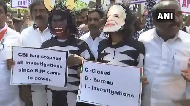 Congress workers hold a protest outside the CBI office in Bengaluru against the removal of CBI director Alok Verma.