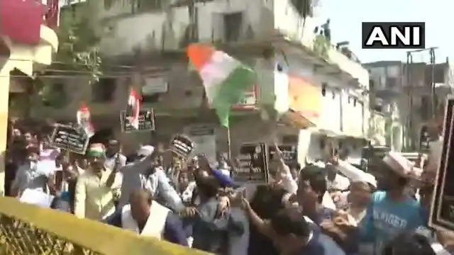 Congress workers hold a protest outside the CBI office in Lucknow against the removal of CBI Director Alok Verma.