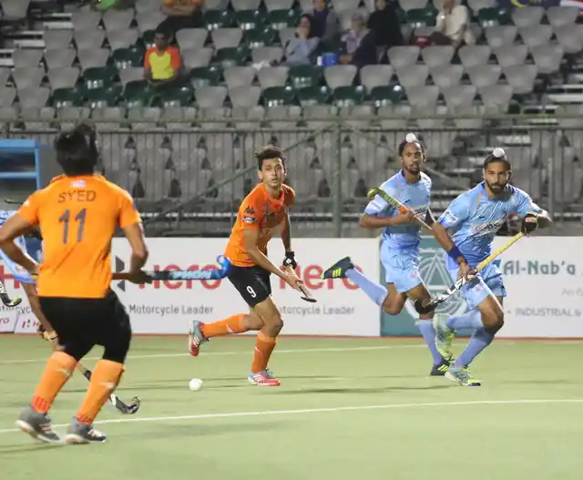 Akashdeep Singh vies for the ball.