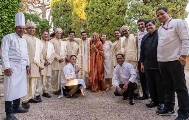 The newlyweds with the wedding management team.
