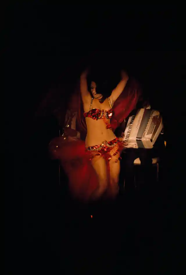 An Egyptian belly dancer performs for tourists in a nightclub in Cairo, 1972.