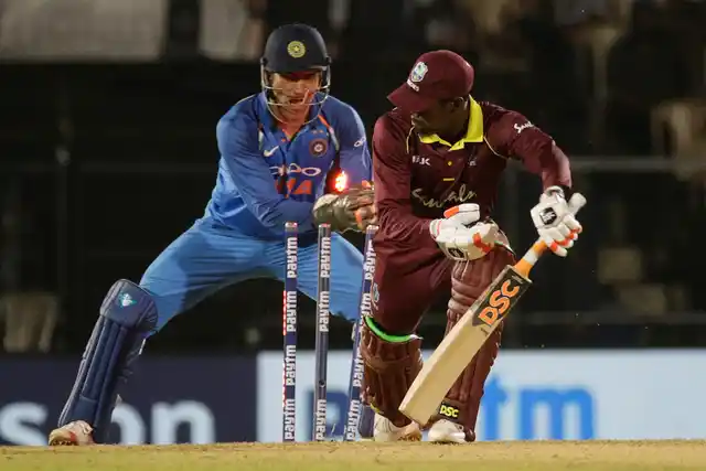 MS Dhoni successfully completes a stumping during India’s 4th ODI against West Indies at Mumbai.
