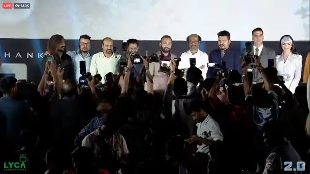 The <i>2.0</i> team on stage. 