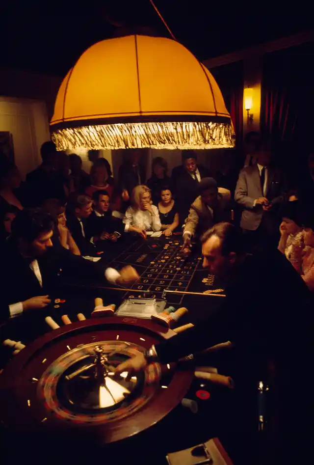 Visitors crowd a casino roulette table in Swaziland, 1969.