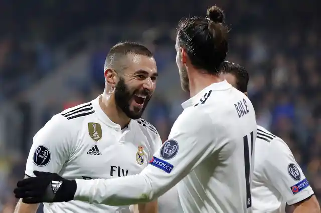 Karim Benzema, left, celebrates after scoring his side’s third goal against Viktoria Plzen.