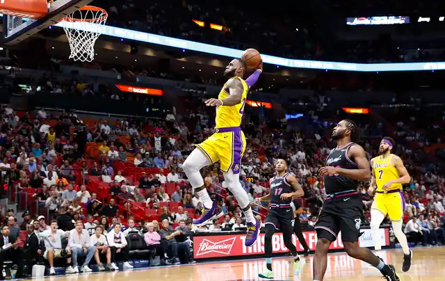 Los Angeles Lakers forward LeBron James scores during the first quarter of an NBA basketball game against the Miami Heat, Sunday, Nov. 18, 2018, in Miami, Fla. 
