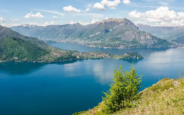 The blue waters of Lake Como with the Alps in the background.
