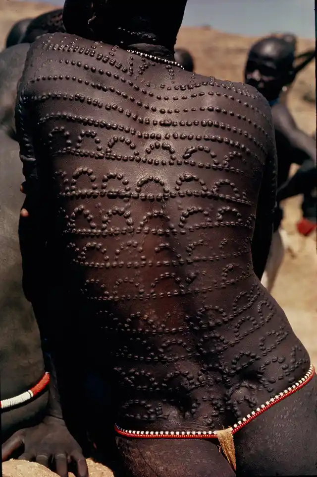 Welts, scars of beauty, pattern the entire back of a Nuba woman in Sudan, 1966.