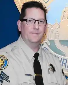 Sergeant Ron Helu was killed in the shooting.