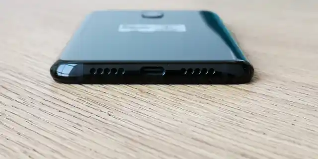 USB Type C for charging, in between the dual speakers. 