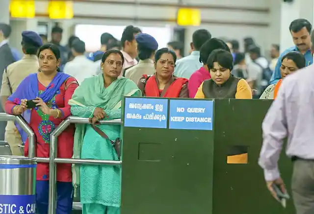 Women’s rights activist Trupti Desai (R) and other women pilgrims wait at the Cochin International Airport after protesters blocked the arrival gate. 