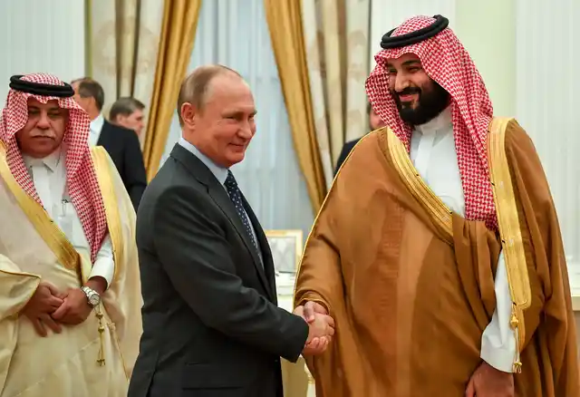 Vladimir Putin (left), shakes hands with Saudi Arabian Crown Prince Mohammed bin Salman, during their meeting in Moscow, Russia.