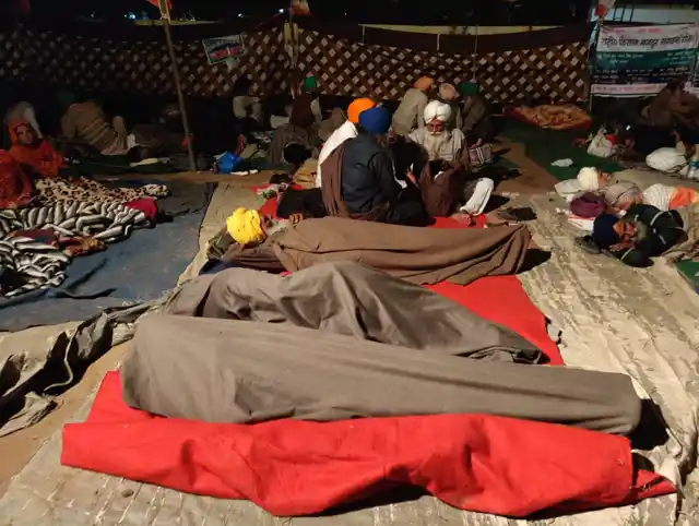 The farmers were tired, yet full of energy.