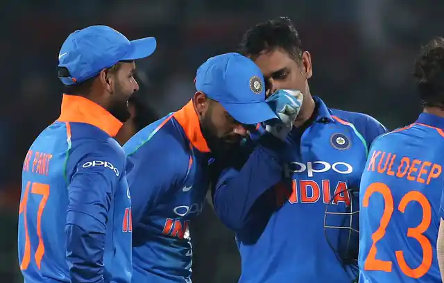 MS Dhoni shares a word with captain Virat Kohli during India’s 2nd ODI against West Indies at Visakhapatnam.