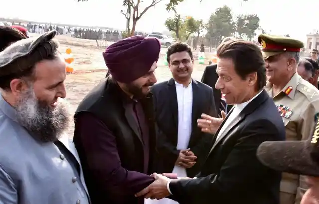 Pakistan Prime Minister Imran Khan shakes hands with Navjot Singh Sidhu during inauguration ceremony for Kartarpur corridor in Pakistan on Wednesday, 28 November.