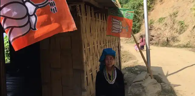 Janaki has BJP flags at the entrance to her house.