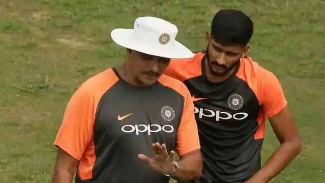 India’s head coach Ravi Shastri (left) instructs Khaleel Ahmed during a practice session.