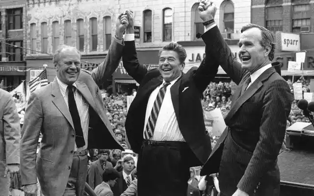 In this 1980 photo, former President Gerald Ford lends his support to Republican presidential candidate Ronald Reagan and his running mate, George HW Bush in Peoria, Illinois.