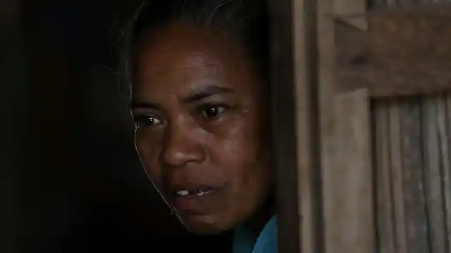 Margarita Oematan, grandmother of Orance Faot, looks out of her home in O’of Village in West Timor, Indonesia.