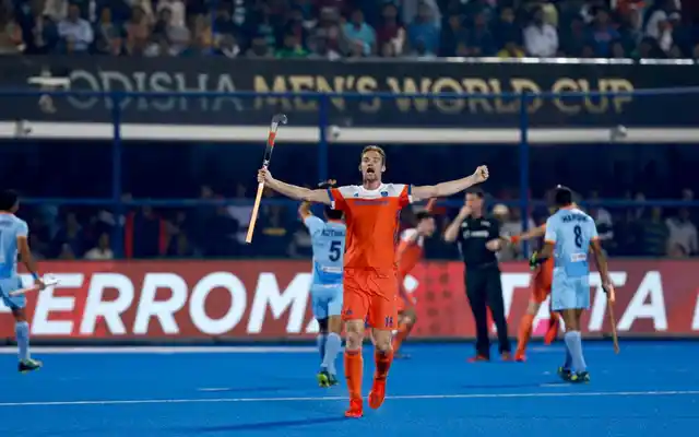 Indian players seen protesting in the background as Netherlands celebrate their second goal during the World Cup quarter-final.
