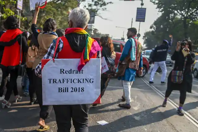 A protester dons a placard opposing the Trafficking Bill 2018