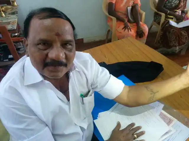 M Chakrapani MLA showing his two leaves tattoo.