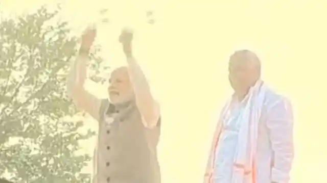 Modi playing the traditional drum in Rajasthan’s Dausar. 