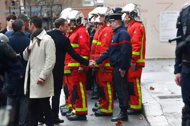Hours after he flew back to the French capital from the G-20 summit in Argentina, Macron held an emergency meeting at the Elysee presidential palace while crews worked to remove charred cars, broken glass and graffiti from the famed Champs-Elysees Avenue and other top Paris sites.