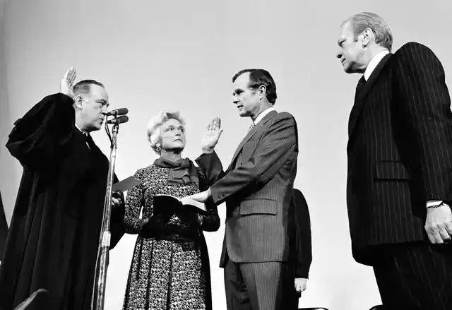 George HW Bush is sworn in as director of the Central Intelligence Agency by Supreme Court Associate Justice Potter Stewart, left, as Barbara Bush and President Gerald Ford, look on at CIA headquarters.