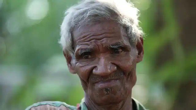 Laurencius Kollo, great-uncle of Marselina Neonbota, speaks to the Associated Press in Fatukoko village in West Timor, Indonesia.