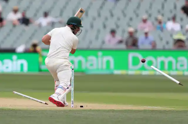 Australia’s Aaron Finch is bowled for no score during the first cricket Test between Australia and India in Adelaide.