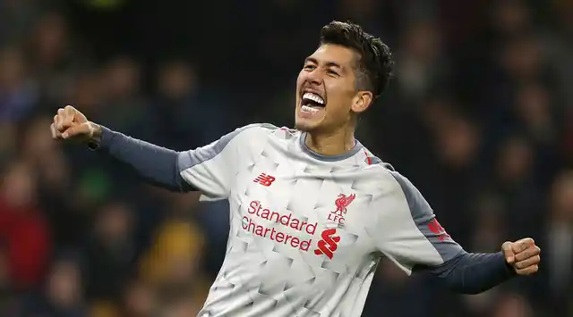 Roberto Firmino celebrates after scoring Liverpool’s second goal against Burnley in their Premier League clash at Turf Moor.