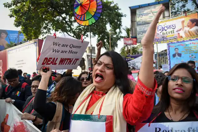 A trans person raises slogans at the Kolkata Rainbow Pride Walk 2018