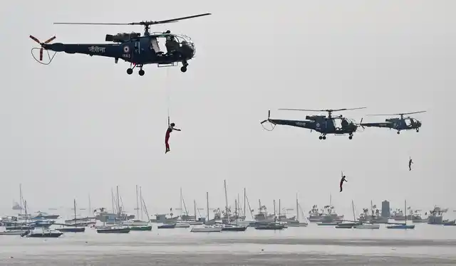 Indian Navy personnel rehearse for the Beating Retreat and Tattoo Ceremony for the Navy Day celebration at the historical Gateway of India in Mumbai on 2 December 2018.