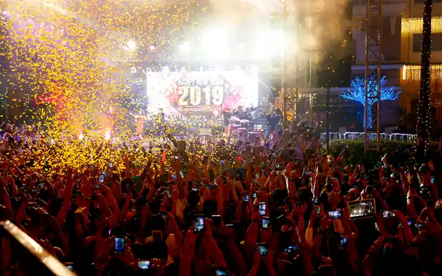 Confetti rains down on revellers at the Eastwood Shopping Mall as Filipinos welcome the New Year on 1 January 2019, in suburban Quezon city northeast of Manila, Philippines. 